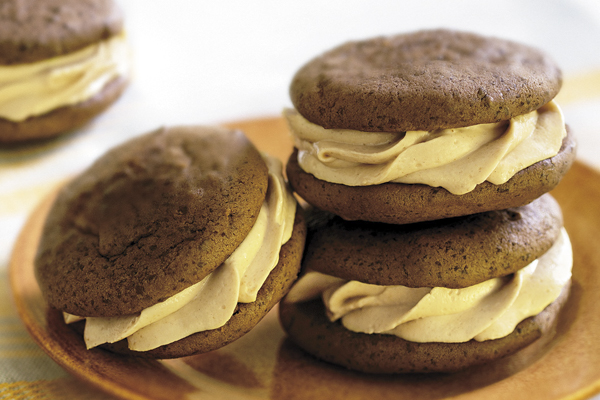 a plate with three chocolate peanut butter whoopie pies